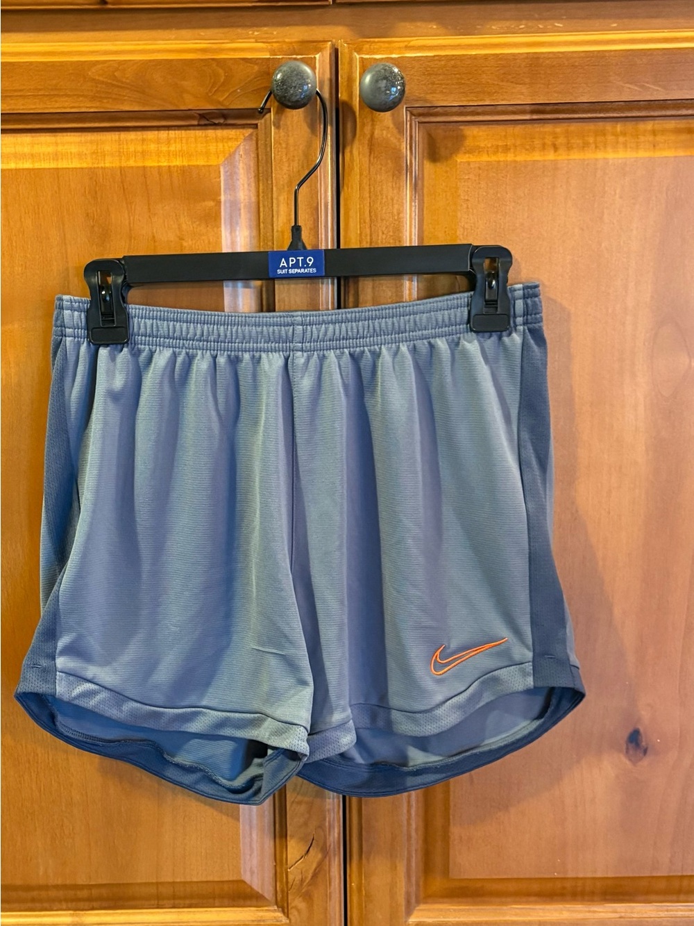 Nike Women’s Athletic Shorts in Slate Blue with Orange Swoosh